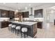 Stylish kitchen with a center island, pendant lighting, and seating for casual dining at 22183 E Rocky Top Pl, Aurora, CO 80016