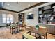 A well-lit library with comfortable seating and built-in bookshelves, perfect for reading at 22183 E Rocky Top Pl, Aurora, CO 80016