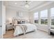 Serene primary bedroom with tray ceiling and large windows, flooding the space with natural light at 22183 E Rocky Top Pl, Aurora, CO 80016