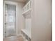 Mudroom area featuring built-in shelving and coat hooks for organization at 22183 E Rocky Top Pl, Aurora, CO 80016