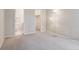 Bedroom featuring neutral colored walls and carpet, with doors to bathroom and closet at 8371 S Upham Way # 103, Littleton, CO 80128