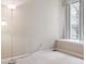 Bright bedroom featuring a neutral palette and large window at 8371 S Upham Way # 103, Littleton, CO 80128