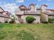 Charming townhouse with well-manicured lawn and attractive landscaping at 8371 S Upham Way # 103, Littleton, CO 80128