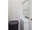 Efficient laundry area with stackable washer and dryer, optimizing space in this home at 8371 S Upham Way # 103, Littleton, CO 80128