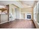 Bright living room featuring a fireplace, vaulted ceilings, and large windows for natural light at 8371 S Upham Way # 103, Littleton, CO 80128