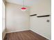 Bright and airy room with modern lighting fixtures and hardwood floors and neutral walls at 8371 S Upham Way # 103, Littleton, CO 80128