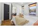 Bright bedroom with hardwood floors and access to living room at 720 Raleigh St, Denver, CO 80204