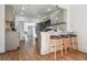 Modern kitchen with gray cabinets, marble countertops, and breakfast bar at 720 Raleigh St, Denver, CO 80204