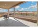 Covered back patio featuring a scenic view and comfortable seating, perfect for outdoor relaxation at 6725 Mentha Dr, Castle Rock, CO 80108