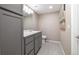 Well-lit bathroom featuring a modern vanity with quartz countertop and contemporary fixtures at 6725 Mentha Dr, Castle Rock, CO 80108