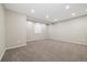 Spacious bedroom with plush carpeting and recessed lighting provides a comfortable, versatile living space at 6725 Mentha Dr, Castle Rock, CO 80108