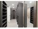 Large walk-in closet with custom shelving, offering ample storage and organization solutions at 6725 Mentha Dr, Castle Rock, CO 80108