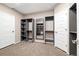 Well-organized walk-in closet with custom shelving units and ample storage space, brightened by natural light at 6725 Mentha Dr, Castle Rock, CO 80108
