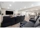 Finished basement home theater with tiered seating, wet bar, and custom lighting at 6725 Mentha Dr, Castle Rock, CO 80108