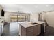 Bright kitchen features granite countertops, modern appliances, and seamless transition to living room at 6725 Mentha Dr, Castle Rock, CO 80108