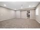 Spacious living area with plush carpet, recessed lighting, and seamless access to the closet at 6725 Mentha Dr, Castle Rock, CO 80108
