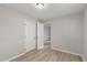 Bright bedroom features neutral paint, light wood floors, and ample closet space at 1050 S Raleigh St, Denver, CO 80219