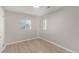 Bedroom features light wood floors, neutral walls, and two windows providing natural light at 1050 S Raleigh St, Denver, CO 80219