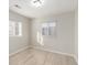 Bedroom featuring two windows providing natural light and light wood floors at 1050 S Raleigh St, Denver, CO 80219