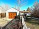 Charming house with a detached garage and a well-maintained front yard at 1050 S Raleigh St, Denver, CO 80219