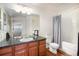 Bathroom features a granite vanity, a large mirror, and a shower-tub combination at 17525 Wilde Ave # 307, Parker, CO 80134