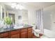 Bathroom features a sleek vanity with a dark countertop and a shower-tub combination at 17525 Wilde Ave # 307, Parker, CO 80134