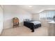 Bedroom featuring neutral colors and a sloped ceiling with a bright window at 17525 Wilde Ave # 307, Parker, CO 80134