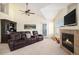 Cozy living room featuring a fireplace, plush seating, and ample natural light at 17525 Wilde Ave # 307, Parker, CO 80134