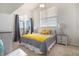 Sun-filled bedroom with a large window and a sliding door to a balcony at 17525 Wilde Ave # 307, Parker, CO 80134