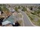 An aerial view captures the home nestled in a serene neighborhood with tree-lined streets at 7006 S Miller Ct, Littleton, CO 80127