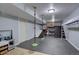Finished basement playroom for with climbing wall, swings and play kitchen at 7006 S Miller Ct, Littleton, CO 80127