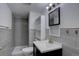 Modern bathroom features a sleek vanity, tiled shower, and stylish decor at 7006 S Miller Ct, Littleton, CO 80127