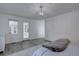 Bright bedroom with access to an enclosed patio offers a peaceful retreat at 7006 S Miller Ct, Littleton, CO 80127