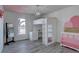 Fun bedroom with a unique loft bed and playful pink accents offers a creative space at 7006 S Miller Ct, Littleton, CO 80127