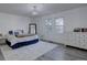 Inviting bedroom featuring a cozy bed, ample natural light, and stylish decor at 7006 S Miller Ct, Littleton, CO 80127