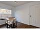 Bright dining room with natural light, a modern table and bench seating perfect for casual meals at 7006 S Miller Ct, Littleton, CO 80127