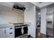 The kitchen features stainless steel appliances, white cabinets, and an open layout at 7006 S Miller Ct, Littleton, CO 80127