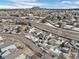 Aerial view of house and neighborhood with snow on the ground at 4224 Deer Watch Dr, Castle Rock, CO 80104