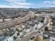 Aerial view of house, street, and neighborhood in winter setting at 4224 Deer Watch Dr, Castle Rock, CO 80104