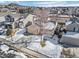 Aerial view of a house and neighborhood in winter at 4224 Deer Watch Dr, Castle Rock, CO 80104