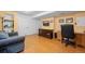 Finished basement office features built-in shelving and comfortable seating at 4224 Deer Watch Dr, Castle Rock, CO 80104