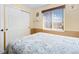 Bedroom with wood furniture and window at 4224 Deer Watch Dr, Castle Rock, CO 80104