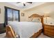 Bright bedroom with wood furniture and window at 4224 Deer Watch Dr, Castle Rock, CO 80104