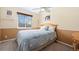 Bedroom with wood furniture and window at 4224 Deer Watch Dr, Castle Rock, CO 80104