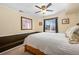 Spacious bedroom with ceiling fan and built-in bench at 4224 Deer Watch Dr, Castle Rock, CO 80104