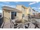 Deck with seating area and glass-top table at 4224 Deer Watch Dr, Castle Rock, CO 80104