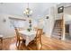 Spacious dining room with hardwood floors and staircase at 4224 Deer Watch Dr, Castle Rock, CO 80104