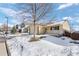 House exterior showcasing a snow-covered front yard at 4224 Deer Watch Dr, Castle Rock, CO 80104