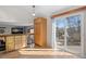 Kitchen with deck access and built-in cabinetry at 4224 Deer Watch Dr, Castle Rock, CO 80104