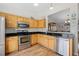 Kitchen features stainless steel appliances and wood cabinets at 4224 Deer Watch Dr, Castle Rock, CO 80104